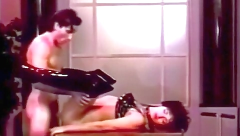 Horny vintage lady with a huge cock in her ass is giving a blowjob