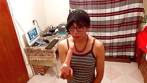 Latina brunette trying to mouth her dildo with deep throat