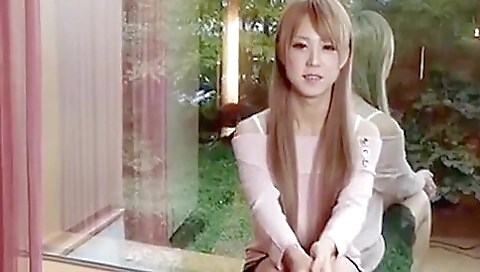 Asian blonde with a sexy body strips naked and jerks off